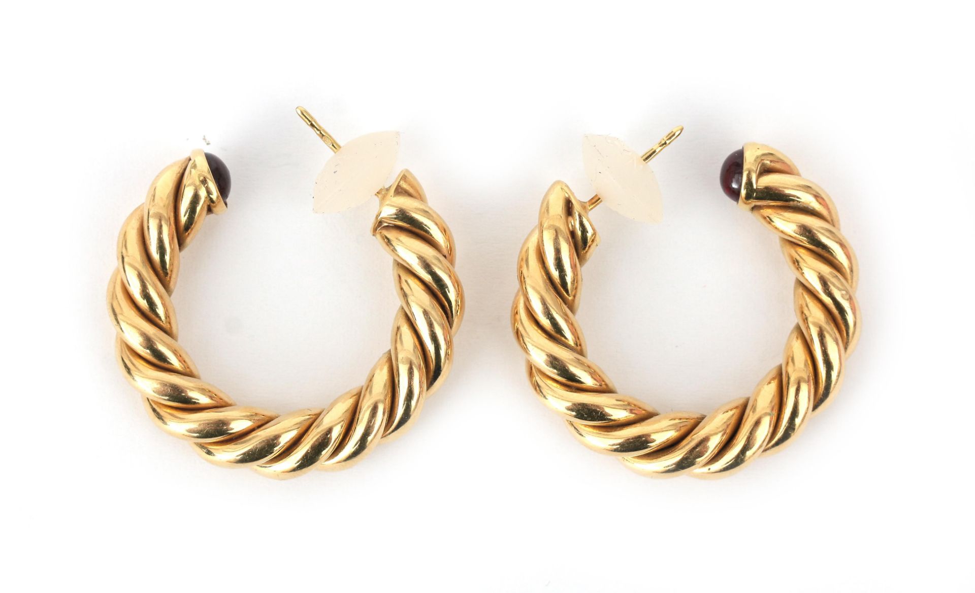 A pair of 18 karat gold twisted hoops with tourmaline