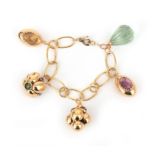 An 18 karat rose gold gem set charm bracelet
