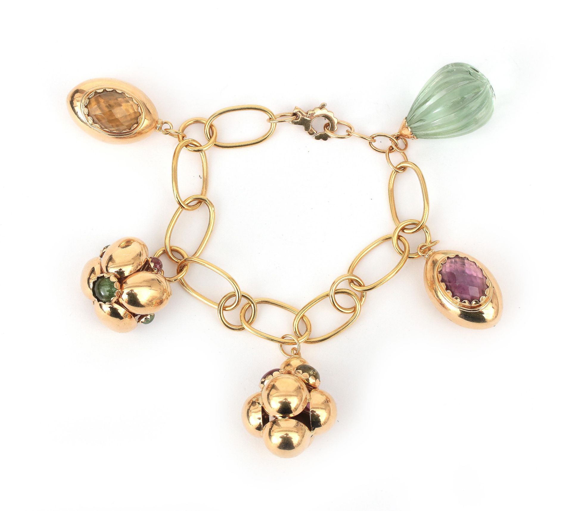 An 18 karat rose gold gem set charm bracelet