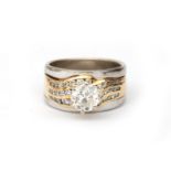 A 14 karat two tone gold diamond solitaire ring, ca. 1.2 ct.