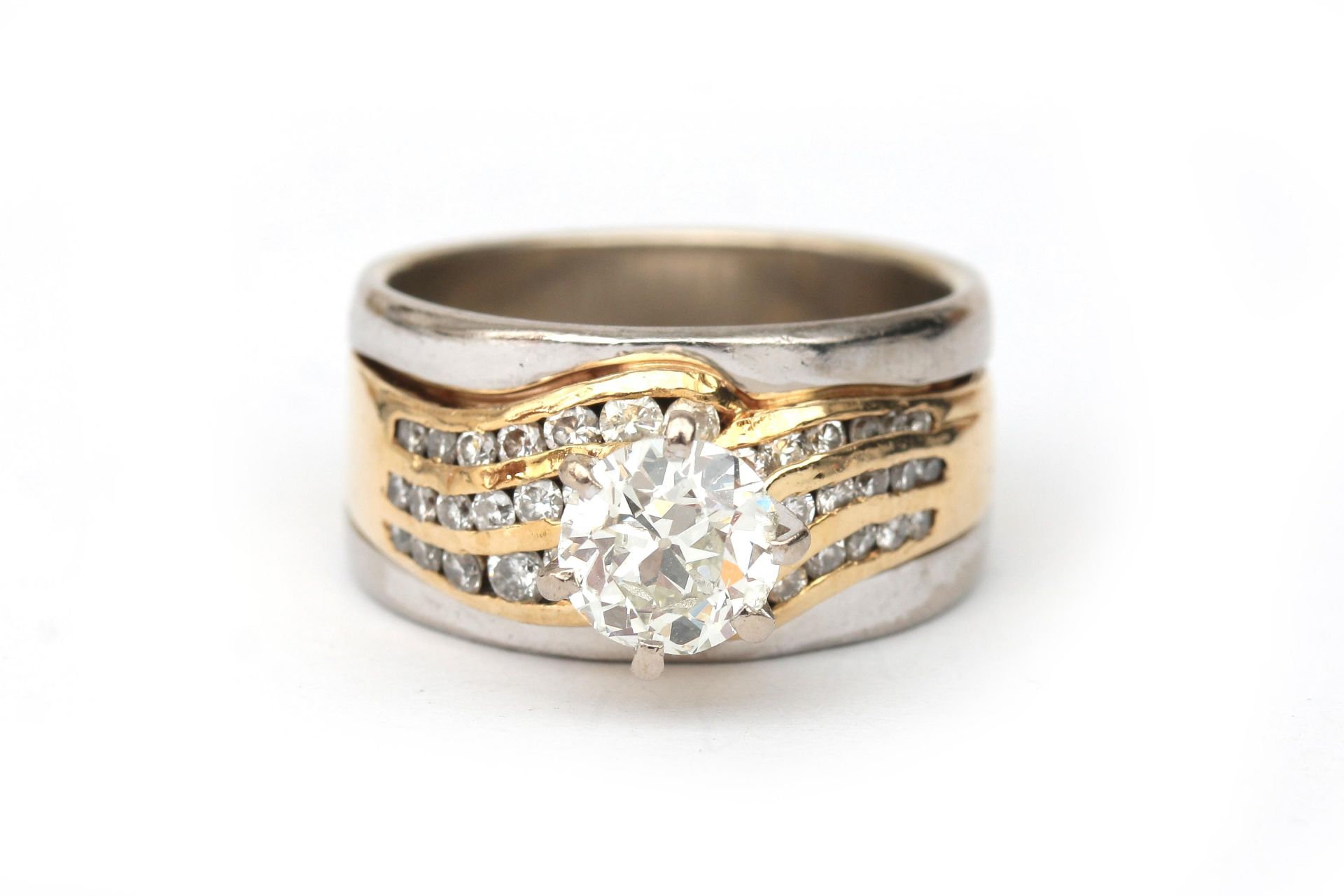 A 14 karat two tone gold diamond solitaire ring, ca. 1.2 ct.