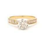 An 18 carat yellow gold diamond solitaire ring