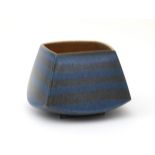 Noor Camstra (1953) A square section stoneware pot with horizontal bands and lustre interior,