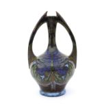 De Distel, Amsterdam A ceramic two-handled vase decorated on both sides with stylised floral