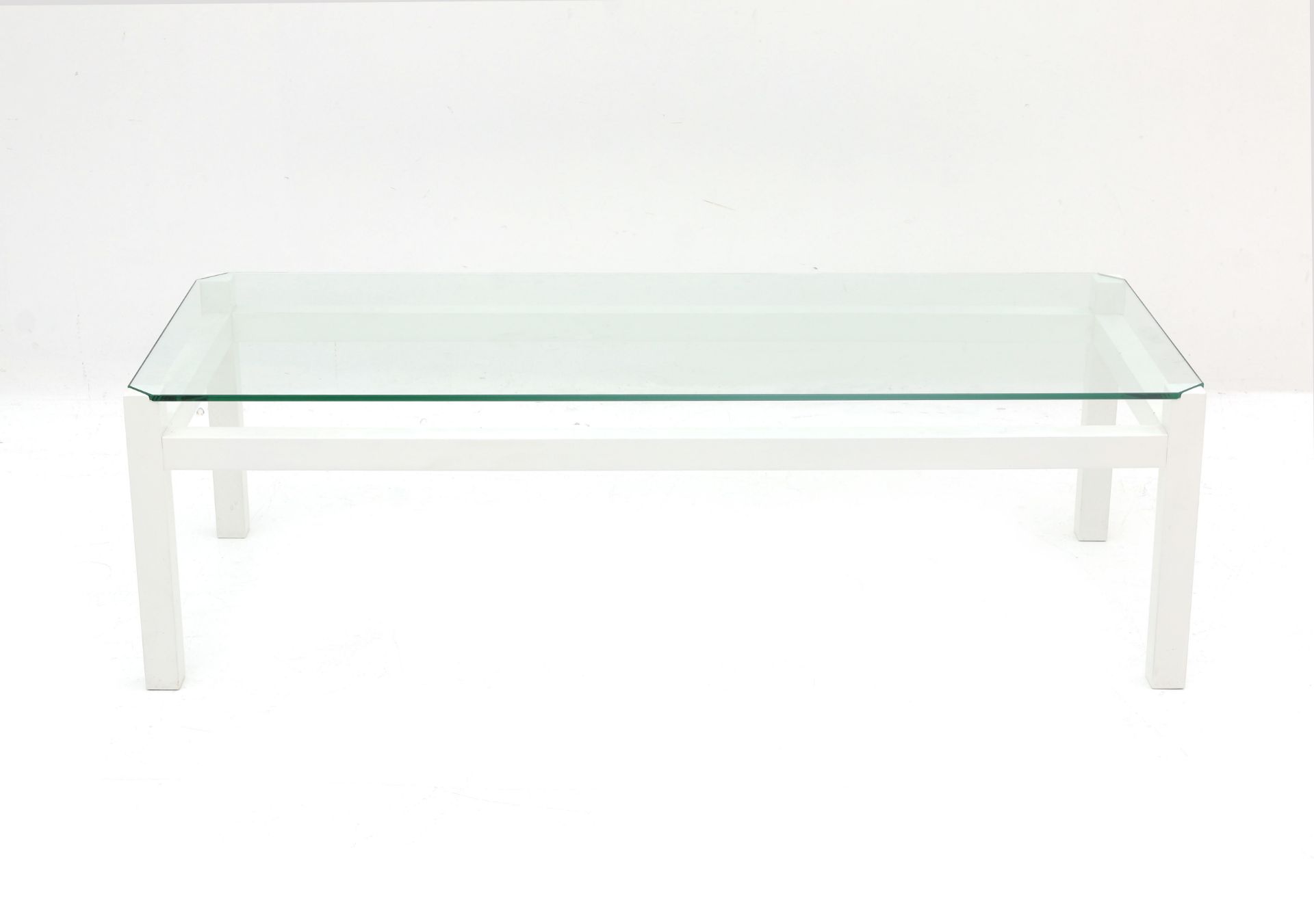 Kho Liang Ie (1927-1975) A rectangular section white lacquered wooden and glass coffee table,