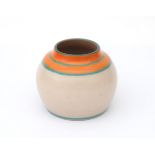 De Vier Paddenstoelen, Utrecht A ceramic vase decorated with orange bands and green lines, on