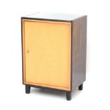 Midcentury Modern A rosewood and beech veneered single door cabinet, the interior with shelf, with