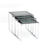 Seventies A three-part nest of occasional tables, chromium plated metal frames with smoke-glass