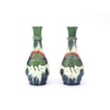 De Porceleyne Fles, Delft Two ceramic vase decorated with birds in blue, green and red on a white