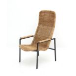 Dirk van Sliedregt (1920-2010) A rattan and black lacquered metal easy chair with oak armrests,