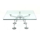 Norman Foster (1935) A chromium plated metal coffee table with square section glass top, from the