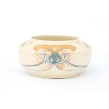 N.V. Arnhemsche Fayencefabriek A matt white glazed ceramic bowl with stylised linear and floral
