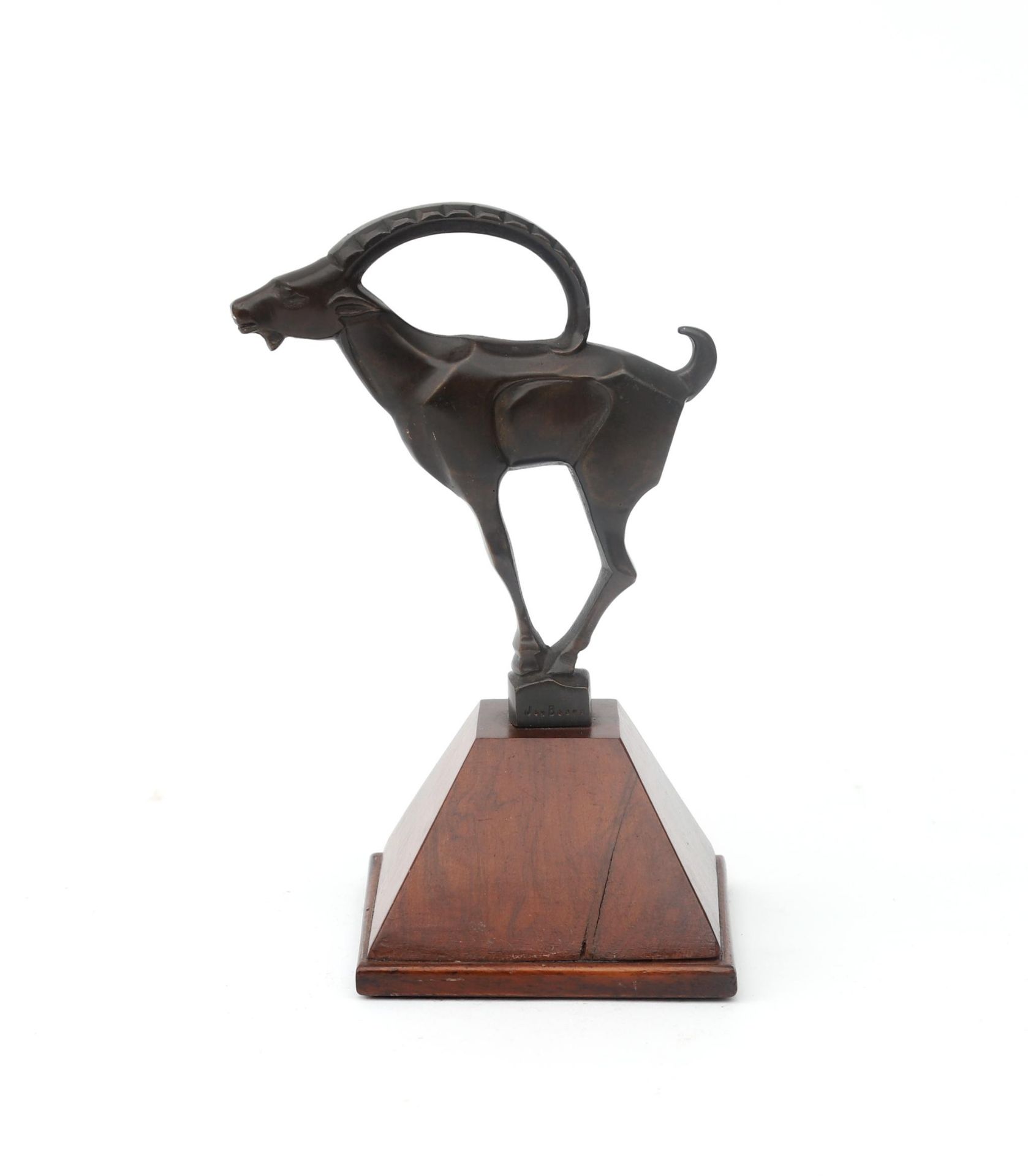 Johannes Bosma (1879-1960) A patinated bronze ibex on walnut base, 1920s, signed to the foot. 15 cm.