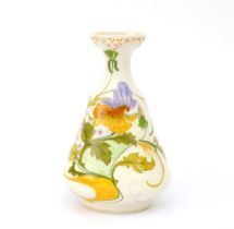 Plateelbakkerij Zuid Holland, Gouda A white glazed ceramic vase with floral pattern, circa 1910,