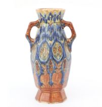 Fayence- en Tegelfabriek Holland, Utrecht An octagonal ceramic vase with two handles, decorated in