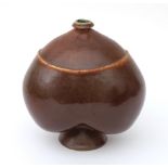 Rolf Overberg (1933-1993) A brown glazed chestnut-shaped stoneware vase on foot, marked