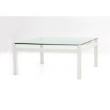 Kho Liang Ie (1927-1975) A square section white lacquered wooden and glass coffee table, model