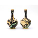Carel Adolph Lion Cachet (1864-1945) A pair of ceramic vases decorated with griffons in orange on