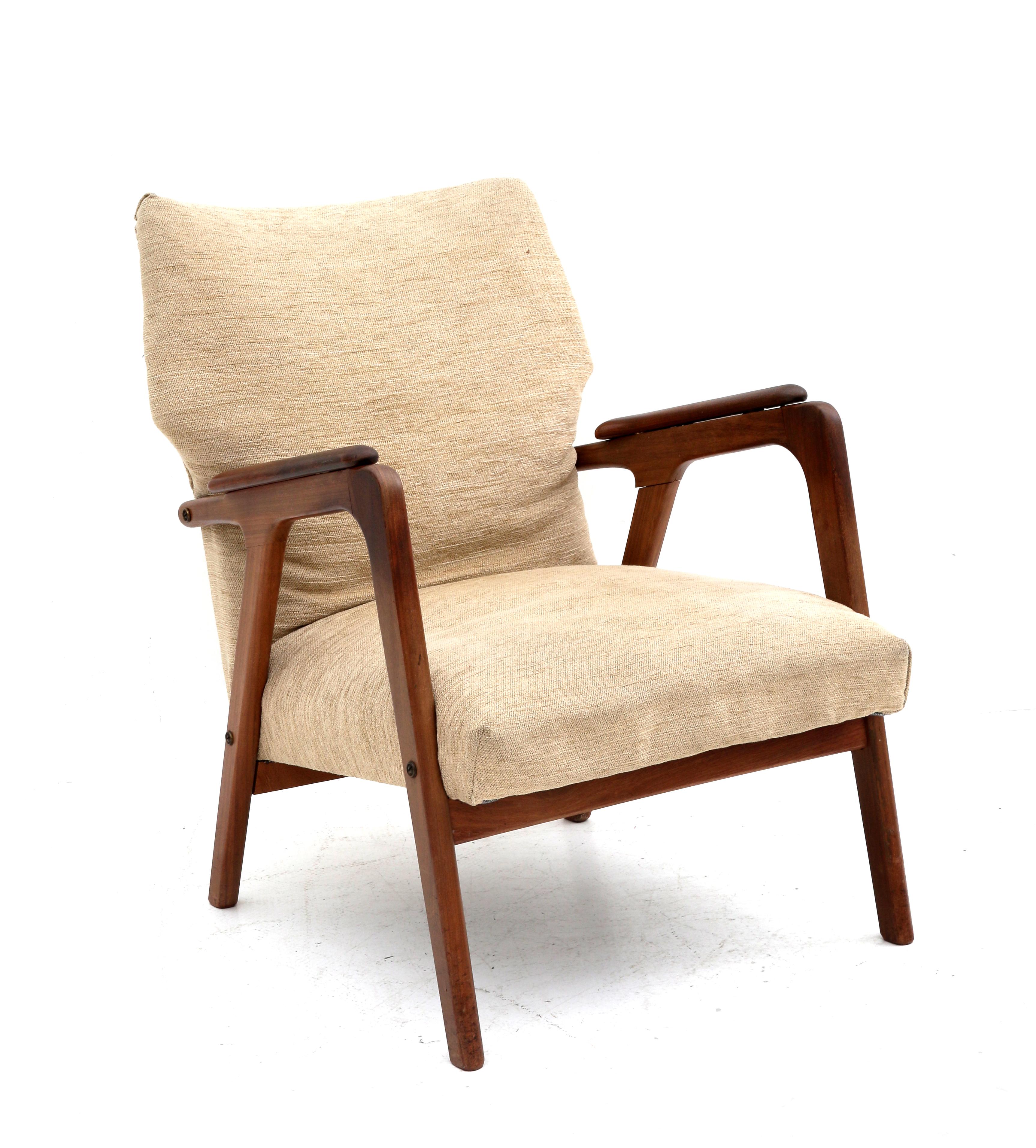 Midcentury Modern A teak easy chair, the seat and backrest with cream fabric upholstery, in the