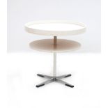 Seventies A circular occasional table with two white lacquered tiers on metal cross-leg base, 1970s,