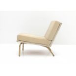 Midcentury Modern An easy chair with cream coloured upholstery, on brass frame, 1960s. 60 cm. h.