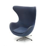 Arne Jacobsen (1902-1971) An Egg-chair, blue fabric upholstered on revolving cross-leg metal base,