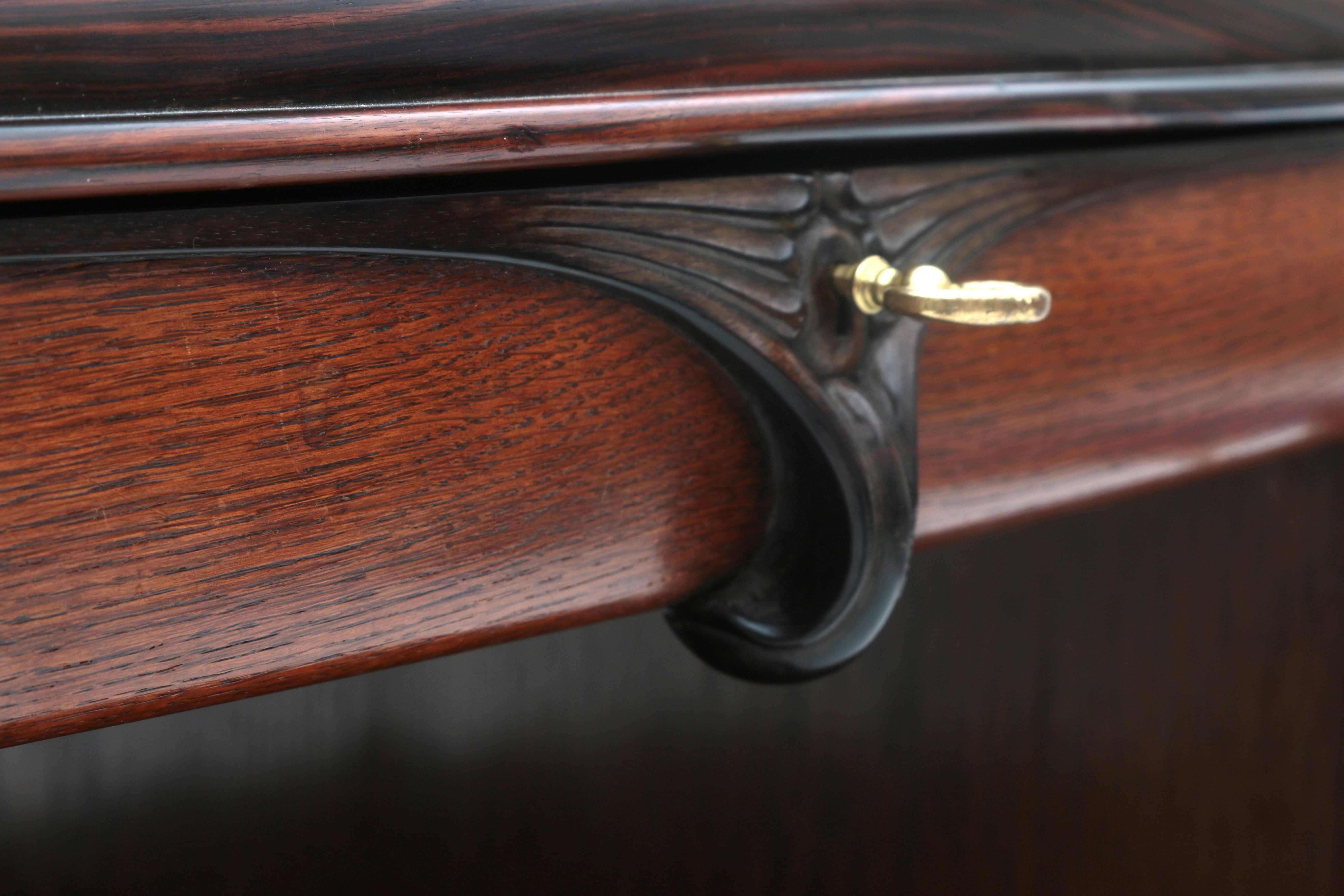 Amsterdamse School An oval oak and carved coromandel tea cabinet, the top with glass pane, with - Image 4 of 7