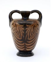 De Distel, Amsterdam A ceramic two-handled vase decorated on both sides with birds, circa 1900, with