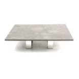 Draenert A modern large square section stone table on four metal feet, marked, with label dated 30.