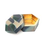 Noor Camstra (1953) A hexagonal shaped stoneware box and cover with blue, green and cream glaze, the