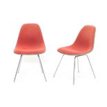 Charles & Ray Eames A pair of DSX chairs, the fibreglass seats upholstered with orange fabric