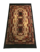 Amsterdamse School A large sofa carpet decorated with geometrical pattern in shades of brown and