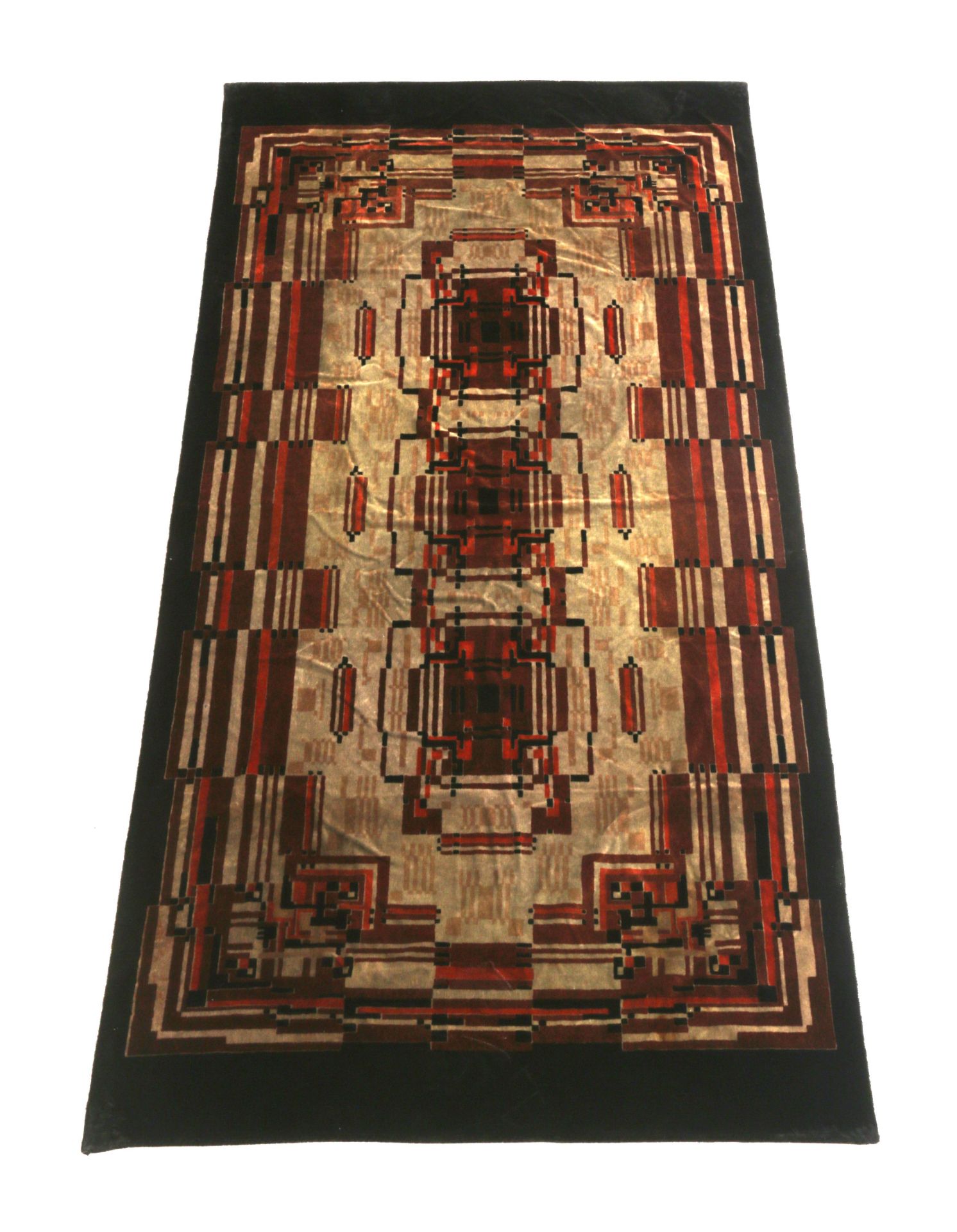 Amsterdamse School A large sofa carpet decorated with geometrical pattern in shades of brown and