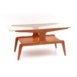 Gio Ponti (1891-1979) in the style of. A walnut coffee table with rounded rectangular glass top,