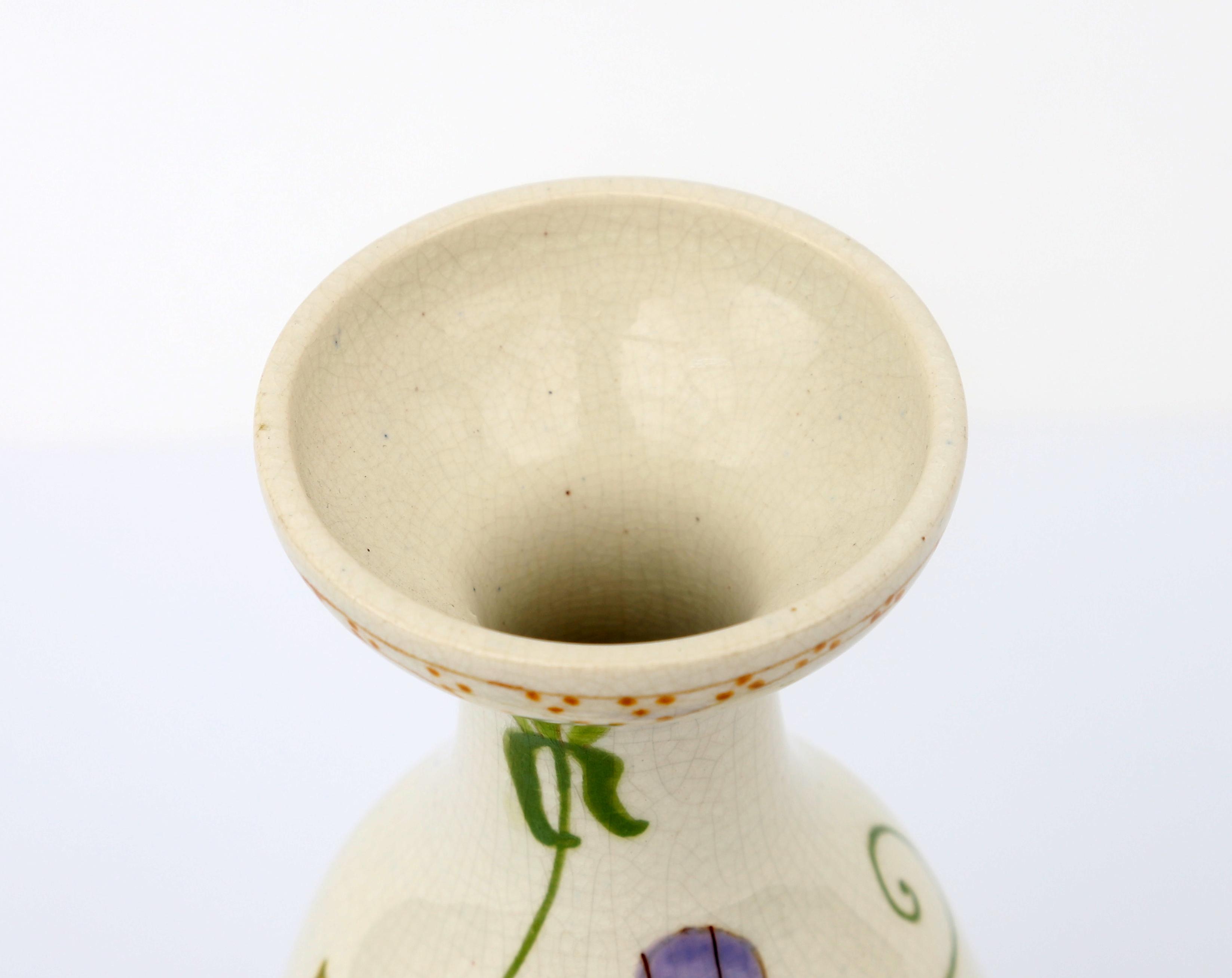 Plateelbakkerij Zuid Holland, Gouda A white glazed ceramic vase with floral pattern, circa 1910, - Image 2 of 4
