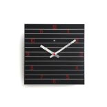 Seventies A square aluminium wall clock, white linear pattern on black ground with red numerals,