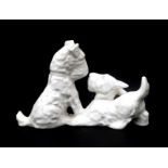 Eta Lempke (1909-1991) A white glazed ceramic figure of two dogs, produced by Plateelbakkerij Zuid-