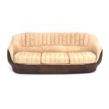 Space Age A cream and brown leather three-seater sofa, in the style of De Sede, 1970s. 71 x 190 x 90