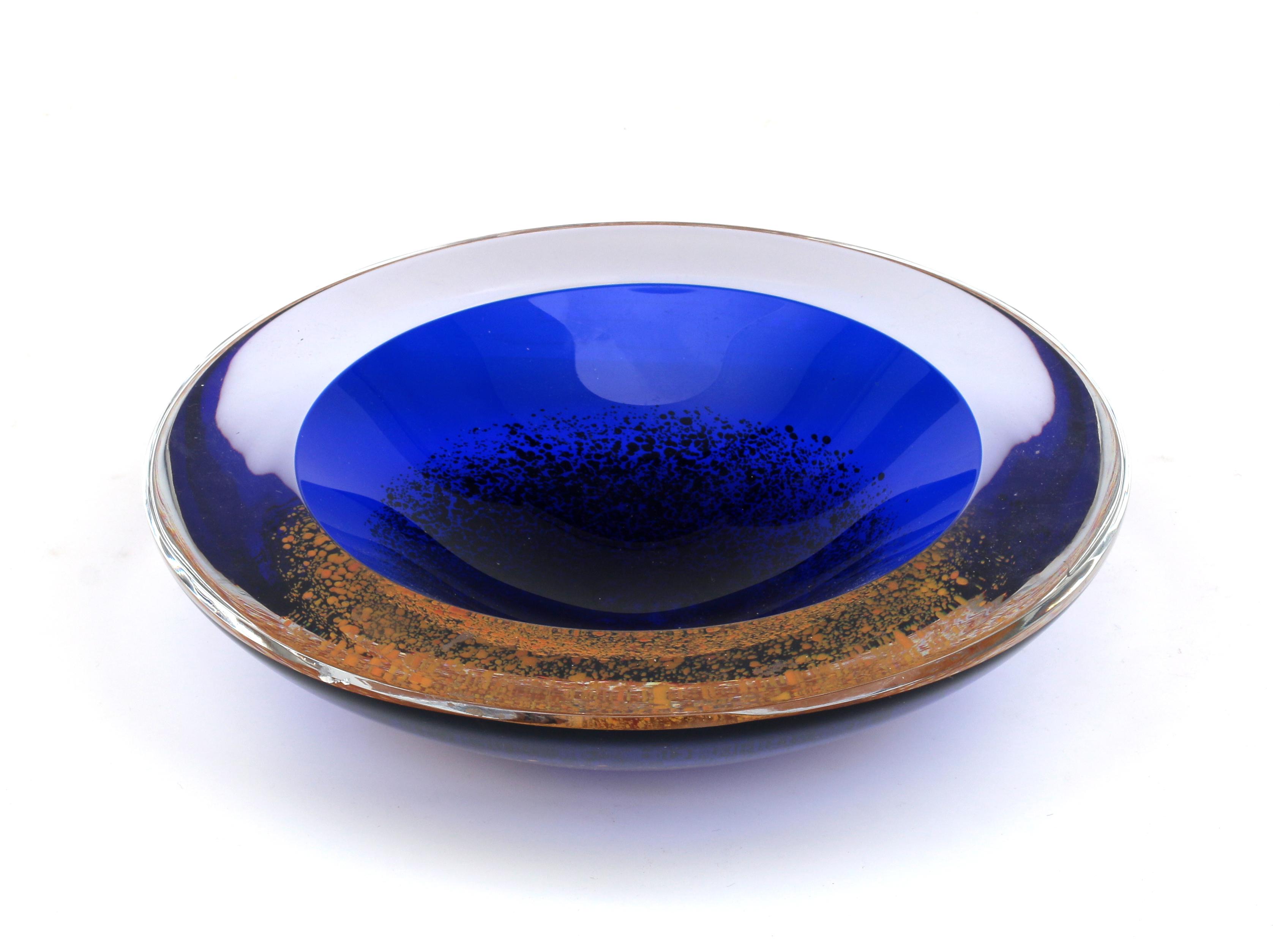 Olaf Stevens (1954) A heavy blue glass dish with clear overlay and yellow inclusions, multiple,