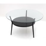 Friso Kramer (1922-2019) A circular black lacquered metal and glass coffee table, model 'Rotonde',