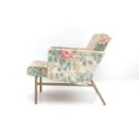 't Spectrum, Bergeyk An easy chair on metal frame, re-upholstered with flower-pattern fabric,