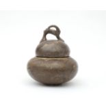 Hildo Krop (1884-1970) A grey/brown glazed ceramic lidded jar, the grip of the handle shaped as an