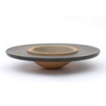 Kyra Spieker (1957) A stoneware bowl shaped as a hat, the rim glazed in black, the centre