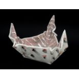 Carol McNicoll (1943) A triangular dish, shaped out of plaques of clay, painted and glazed, circa