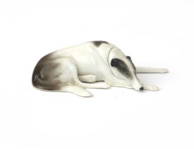 Fritz Pfeffer, Gotha A porcelain figure of a reclining dog, circa 1910-1934, marked underneath