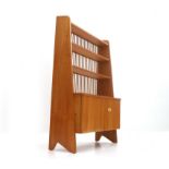 Midcentury Modern A beech wood bookcase with cupboard-compartment and bookshelves with pegs back, in