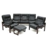 Coja, Culemborg A black leather upholstered and brown lacquered wooden three-seater sofa, a ladie'