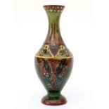 Wed. Brantjes & Co., Purmerend A ceramic vase decorated with flowers, circa 1900, painted