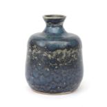 Meindert Zaalberg (1907-1989) A blue/black glazed ceramic vase with compressed top rim, produced