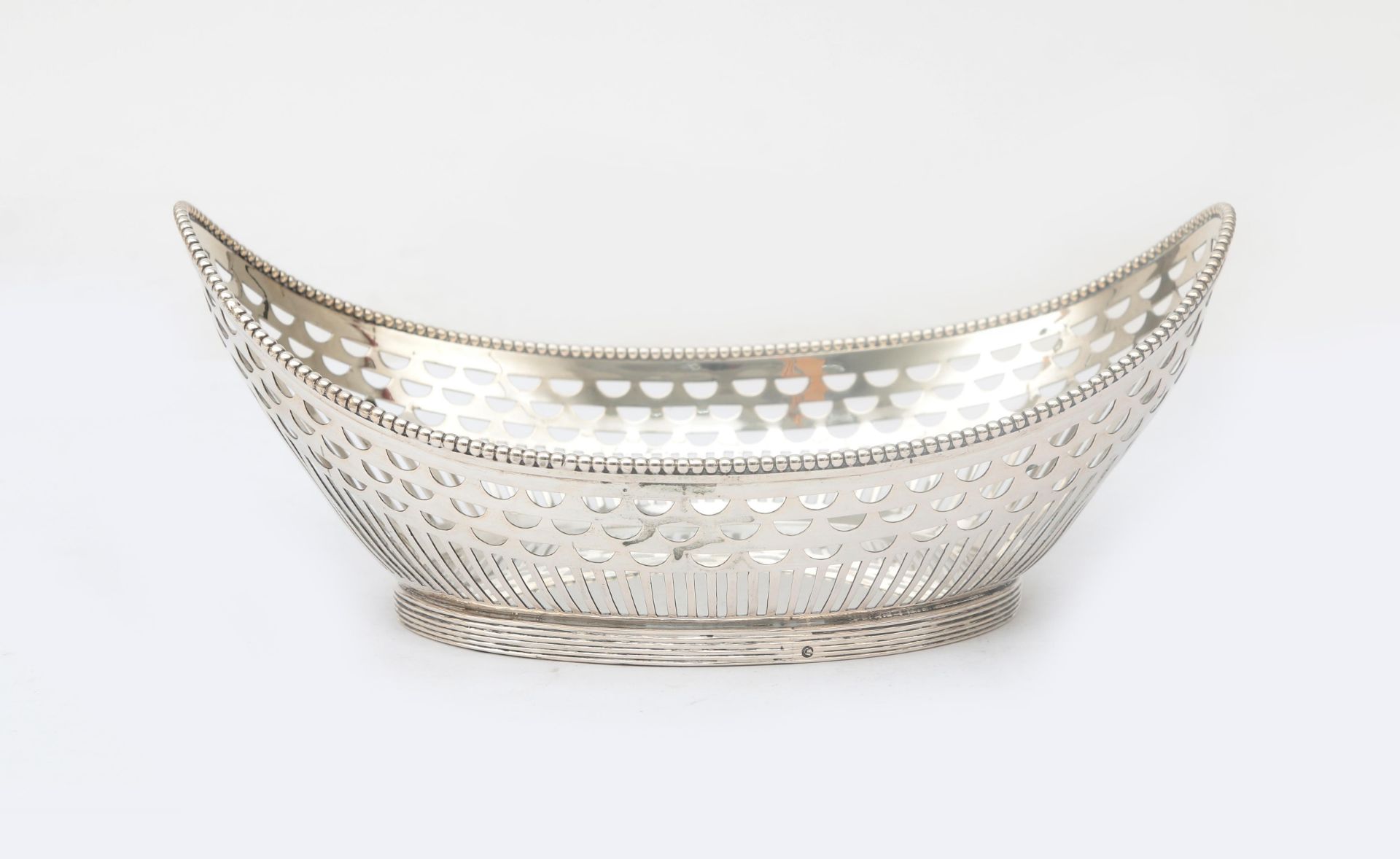 A Dutch ajour sawn 2nd grade silver bread basket with pearl rim on filleted stand ring. Masters